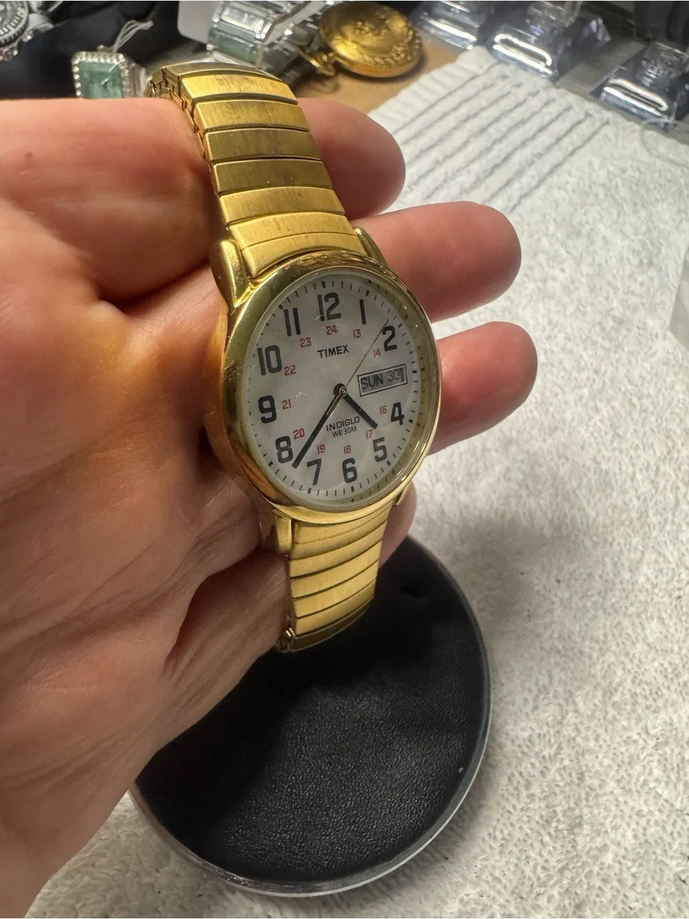 Timex Gold Tone Watch with White Dial and Black Numerals